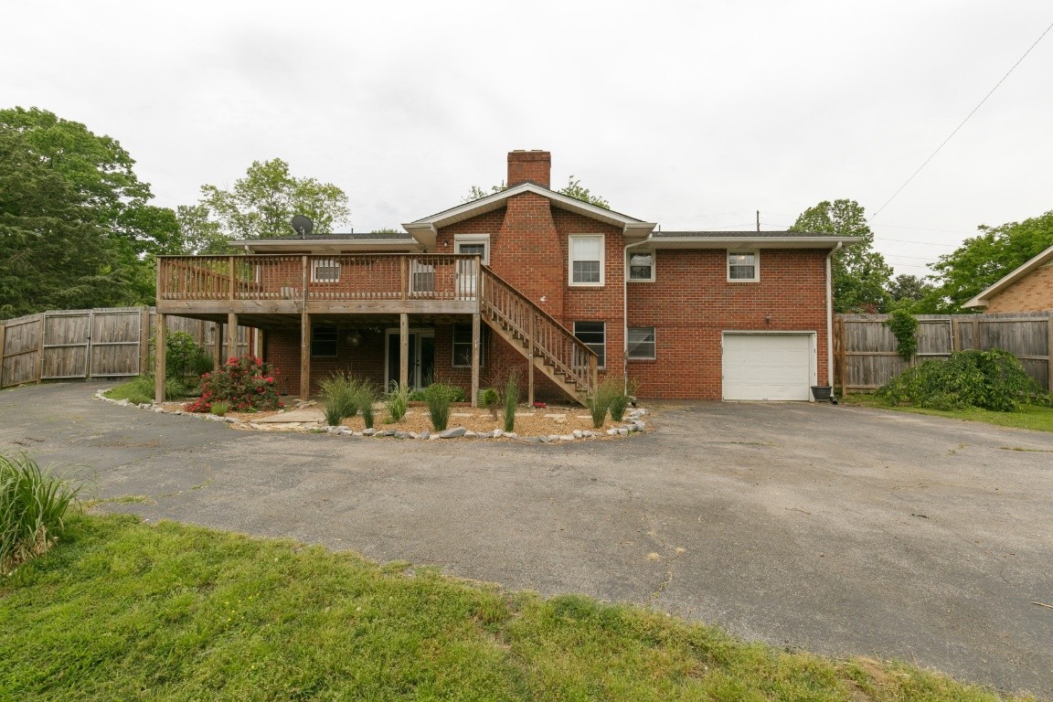 706 Ronnie Road Madison, TN 37115 - Photo 12 of 39 a front view of a house with a yard and garage