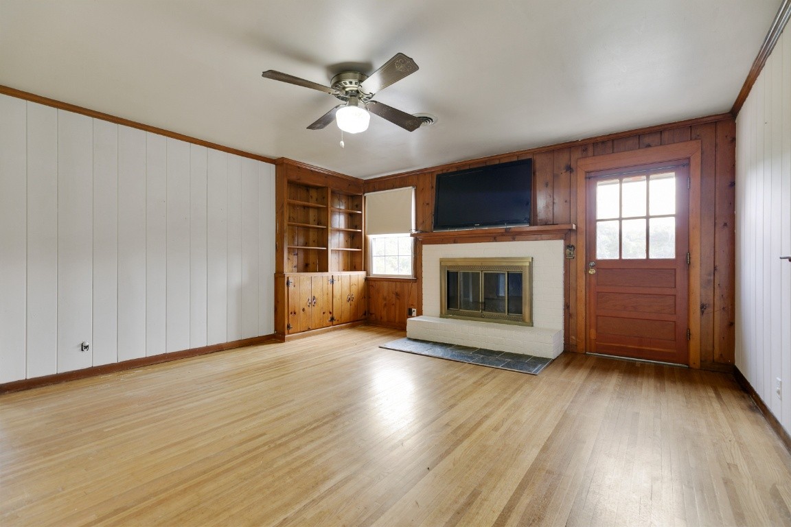 706 Ronnie Road Madison, TN 37115 - Photo 22 of 39 a view of an empty room with a fireplace and a window