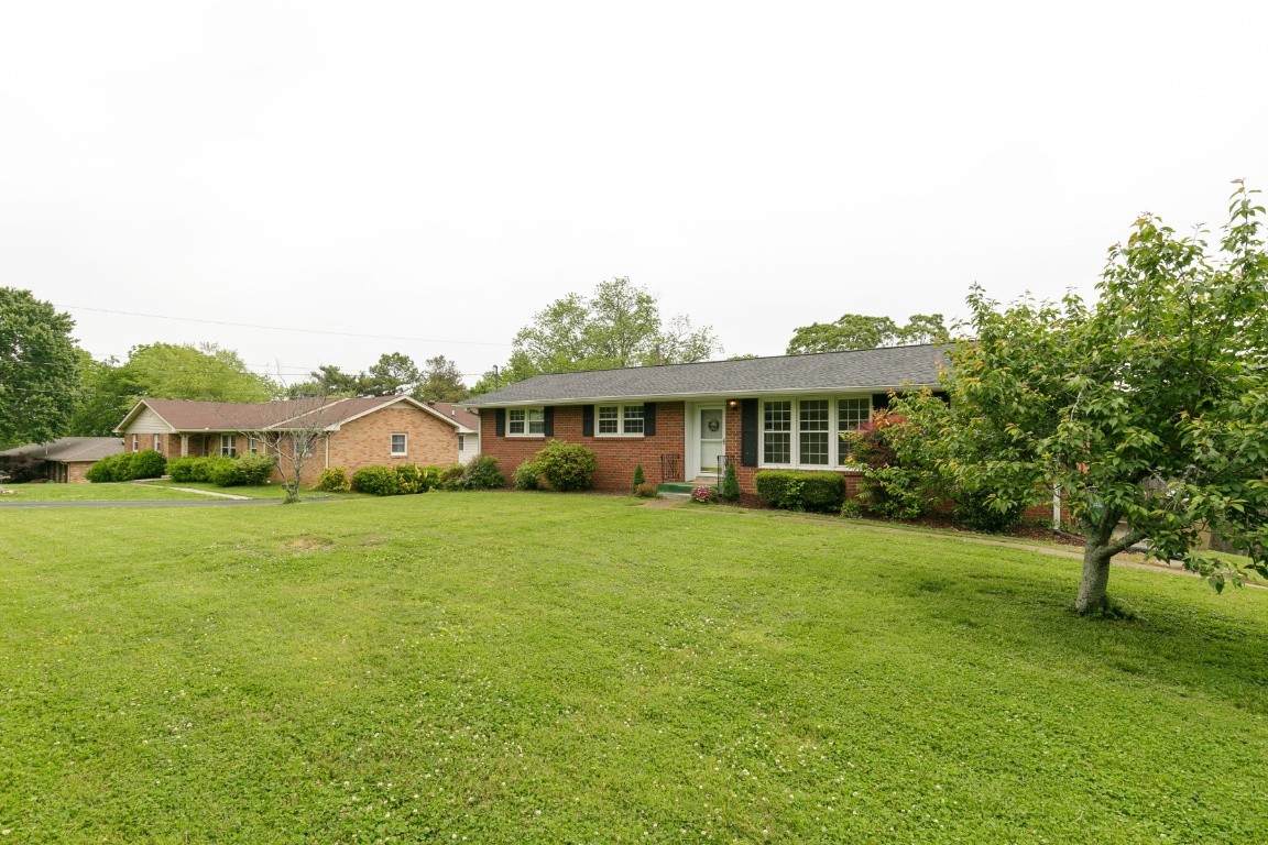 706 Ronnie Road Madison, TN 37115 - Photo 24 of 39 a front view of a house with a garden