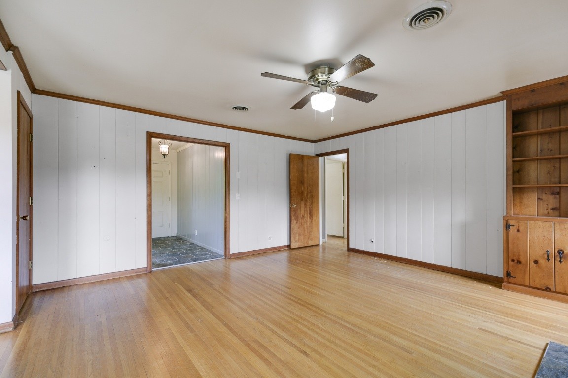 706 Ronnie Road Madison, TN 37115 - Photo 26 of 39 a view of an empty room with wooden floor and a window