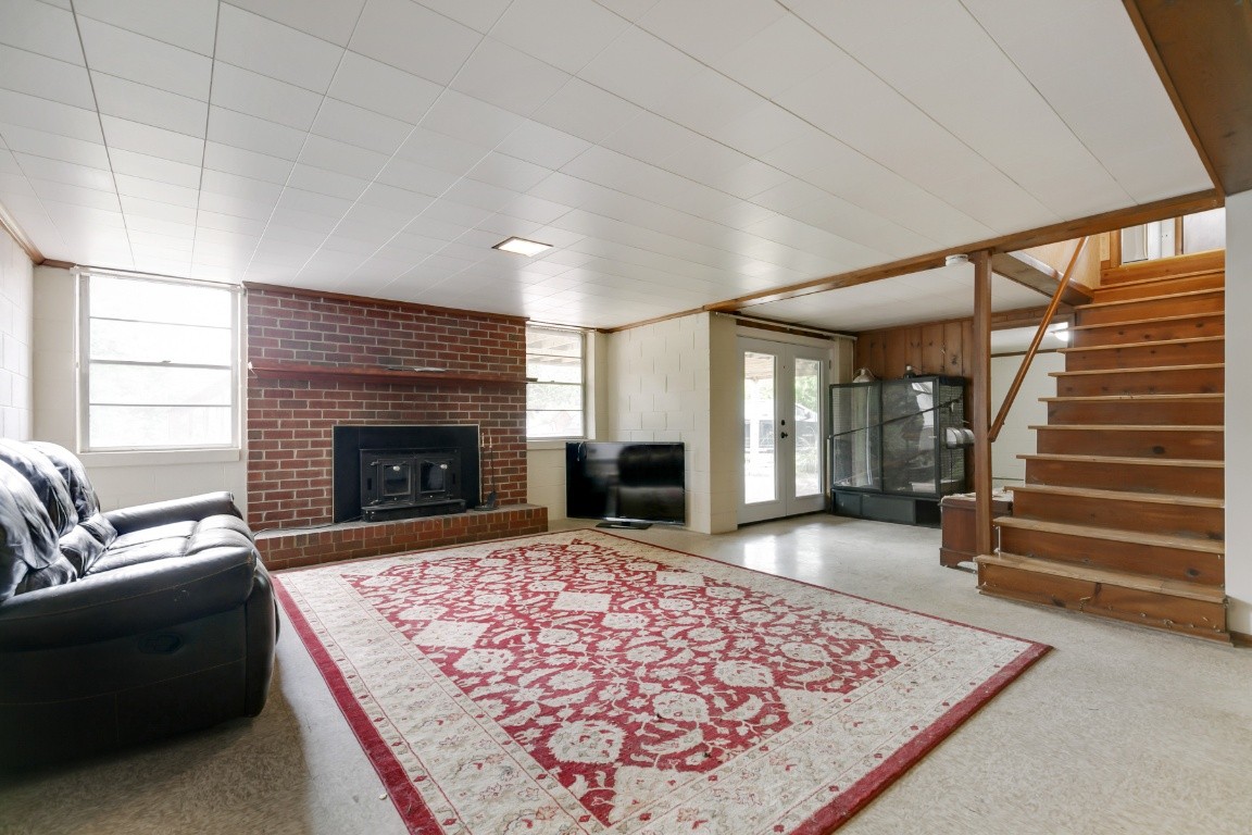 706 Ronnie Road Madison, TN 37115 - Photo 27 of 39 a living room with a rug and a fireplace
