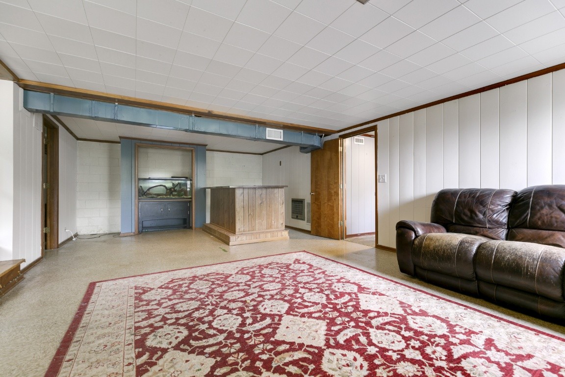 706 Ronnie Road Madison, TN 37115 - Photo 29 of 39 a living room with a couch and a dresser