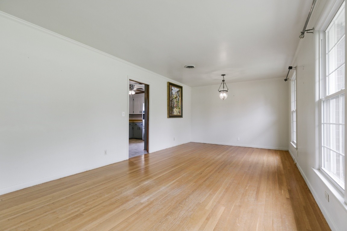 706 Ronnie Road Madison, TN 37115 - Photo 4 of 39 an empty room with wooden floor and windows