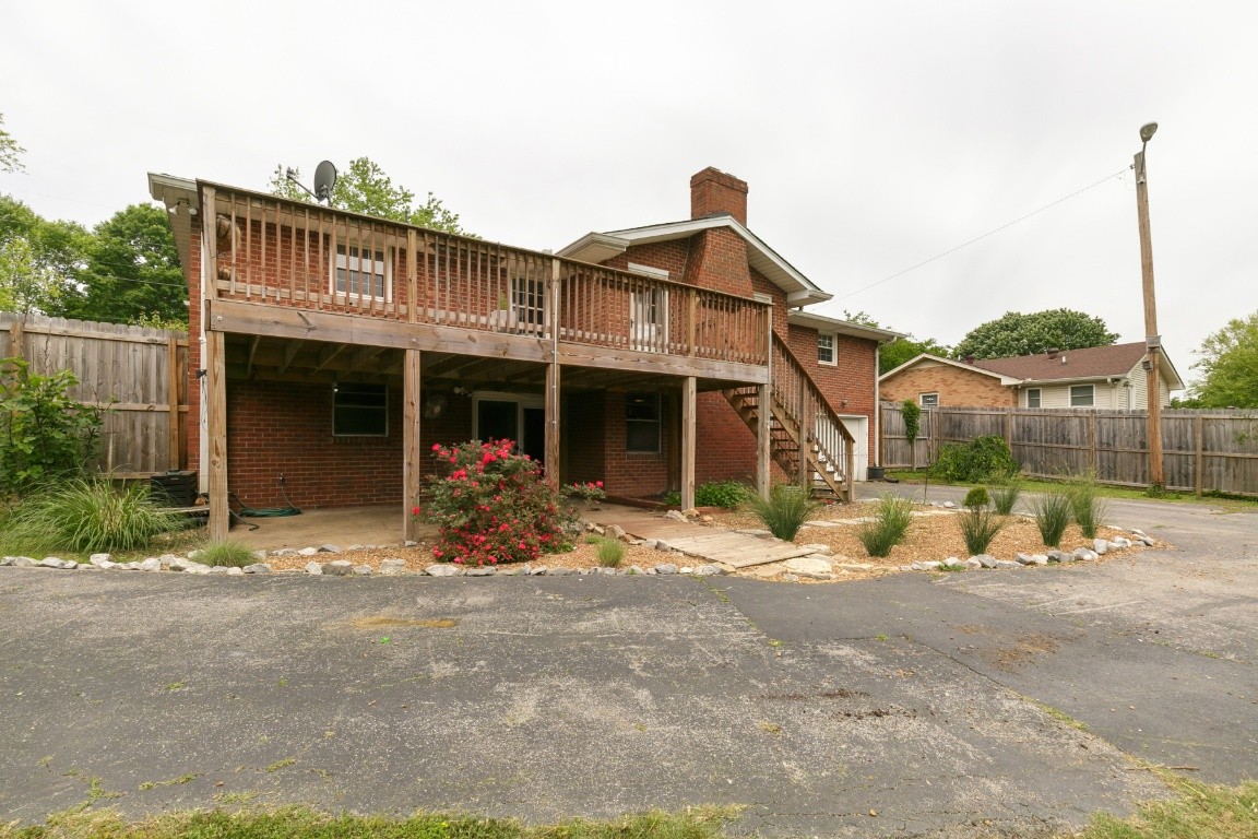 706 Ronnie Road Madison, TN 37115 - Photo 39 of 39 a front view of a house with basket ball court and potted plants
