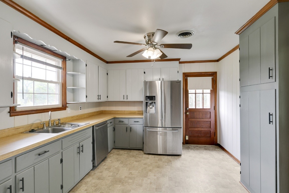 706 Ronnie Road Madison, TN 37115 - Photo 6 of 39 a kitchen with a refrigerator a sink and cabinets