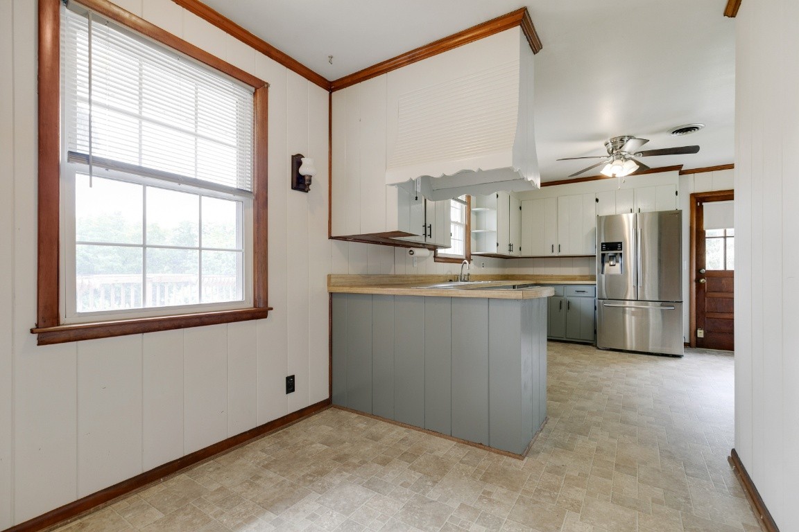 706 Ronnie Road Madison, TN 37115 - Photo 10 of 39 a kitchen with stainless steel appliances granite countertop a stove a sink and a refrigerator