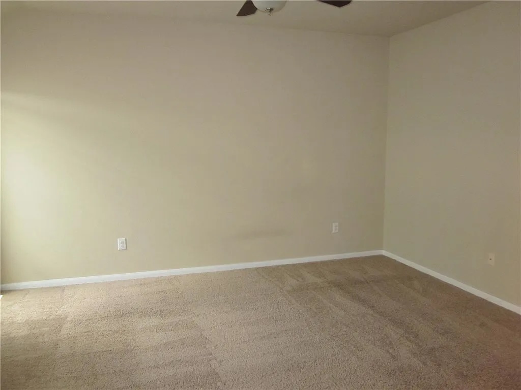 541 Alpha Kyle, TX 78640 - Photo 9 of 9 A spacious room offers comfortable carpet flooring and ample wall space.