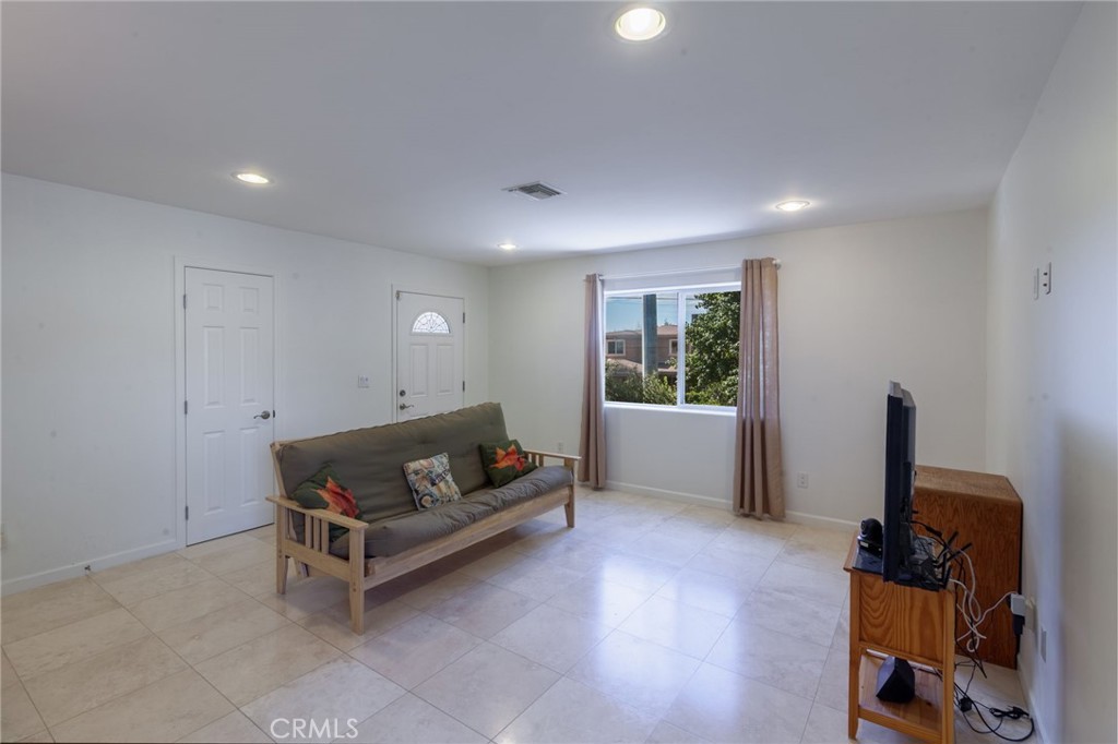 10424 Big Tujunga Canyon Road Tujunga, CA 91042 - Photo 12 of 57 a living room with furniture and a window