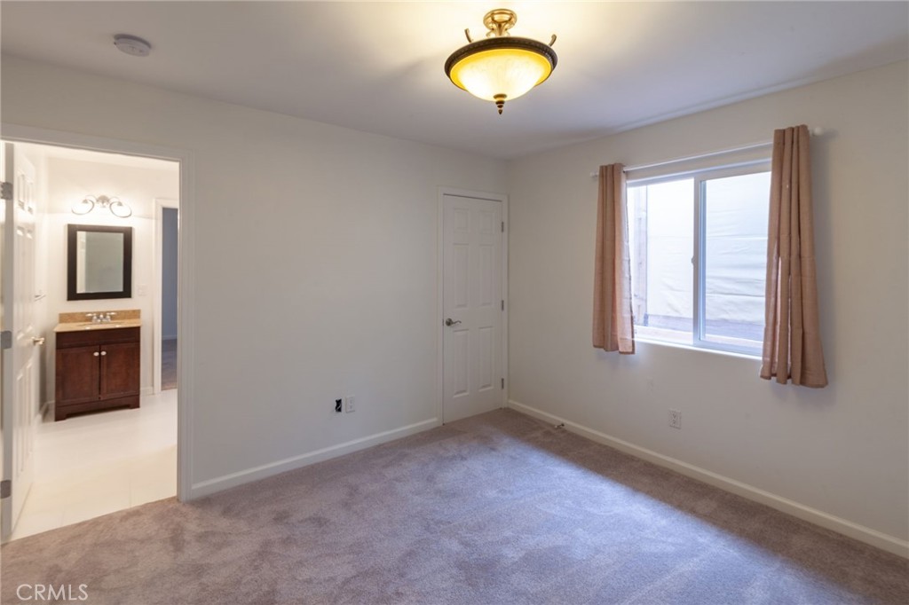 10424 Big Tujunga Canyon Road Tujunga, CA 91042 - Photo 24 of 57 a view of an empty room with a window and dresser