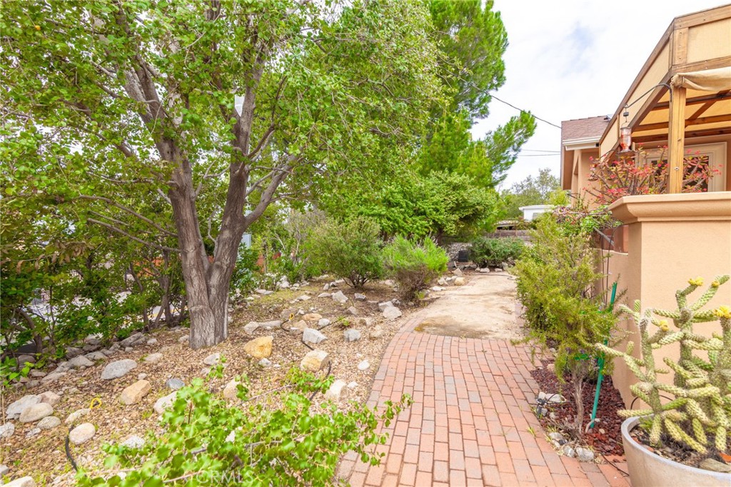 10424 Big Tujunga Canyon Road Tujunga, CA 91042 - Photo 3 of 57 a view of a pathway both side of the house