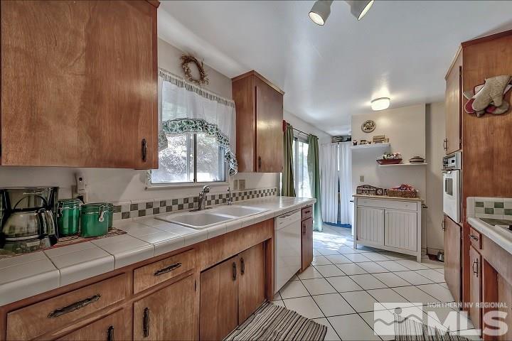 252 North Benjamin Drive Stateline, NV 89449 - Photo 9 of 19 a kitchen with a sink cabinets and stainless steel appliances