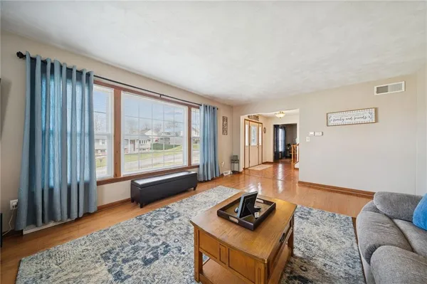 a living room with furniture and a rug