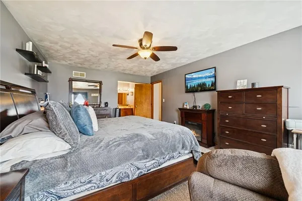 a bedroom with a bed and a dresser
