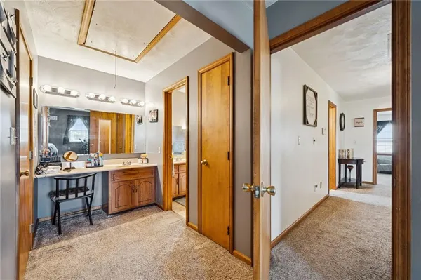 a view of a hallway with kitchen area