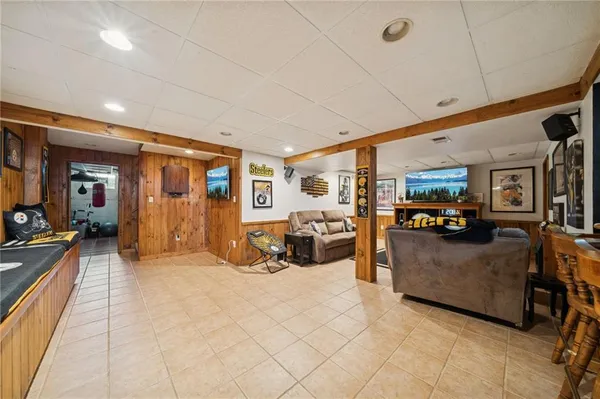 a large kitchen with stainless steel appliances a large counter top