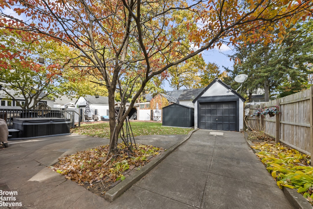 112-14 178th Street Queens, NY 11433 - Photo 23 of 24 a front view of a house with garden