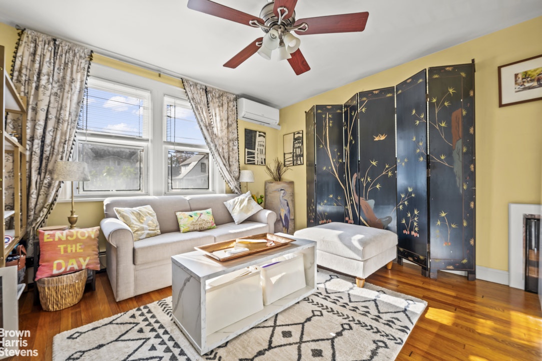 112-14 178th Street Queens, NY 11433 - Photo 9 of 24 a living room with furniture and a window