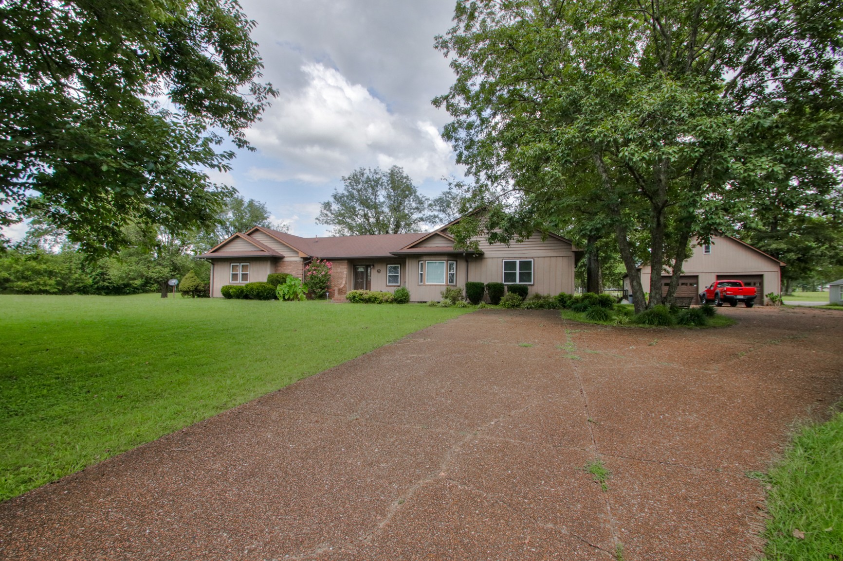 4737 McCrary Road Lebanon, TN 37090 - Photo 1 of 24 a yellow and red house with a garden