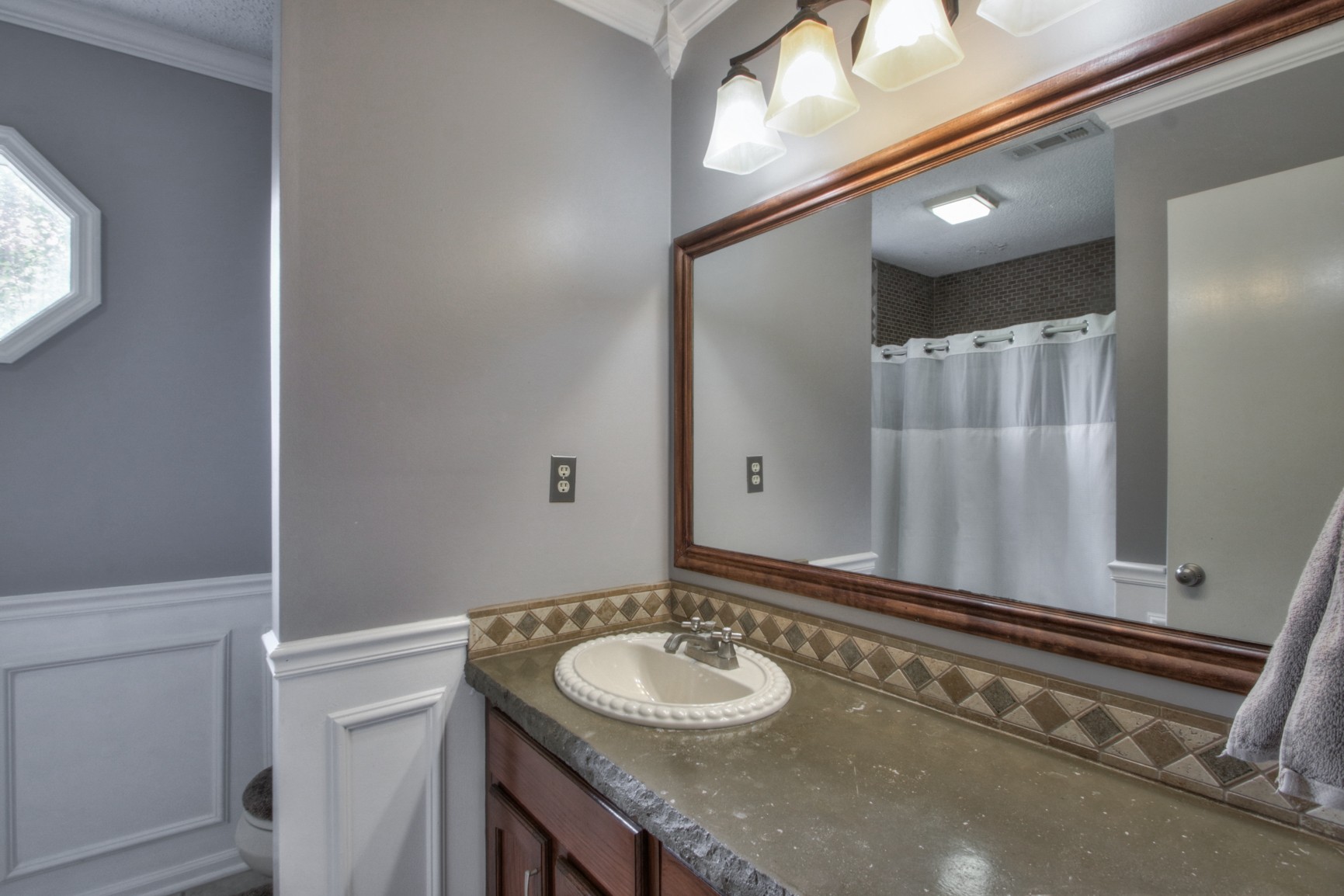 4737 McCrary Road Lebanon, TN 37090 - Photo 11 of 24 a bathroom with a granite countertop sink and a mirror