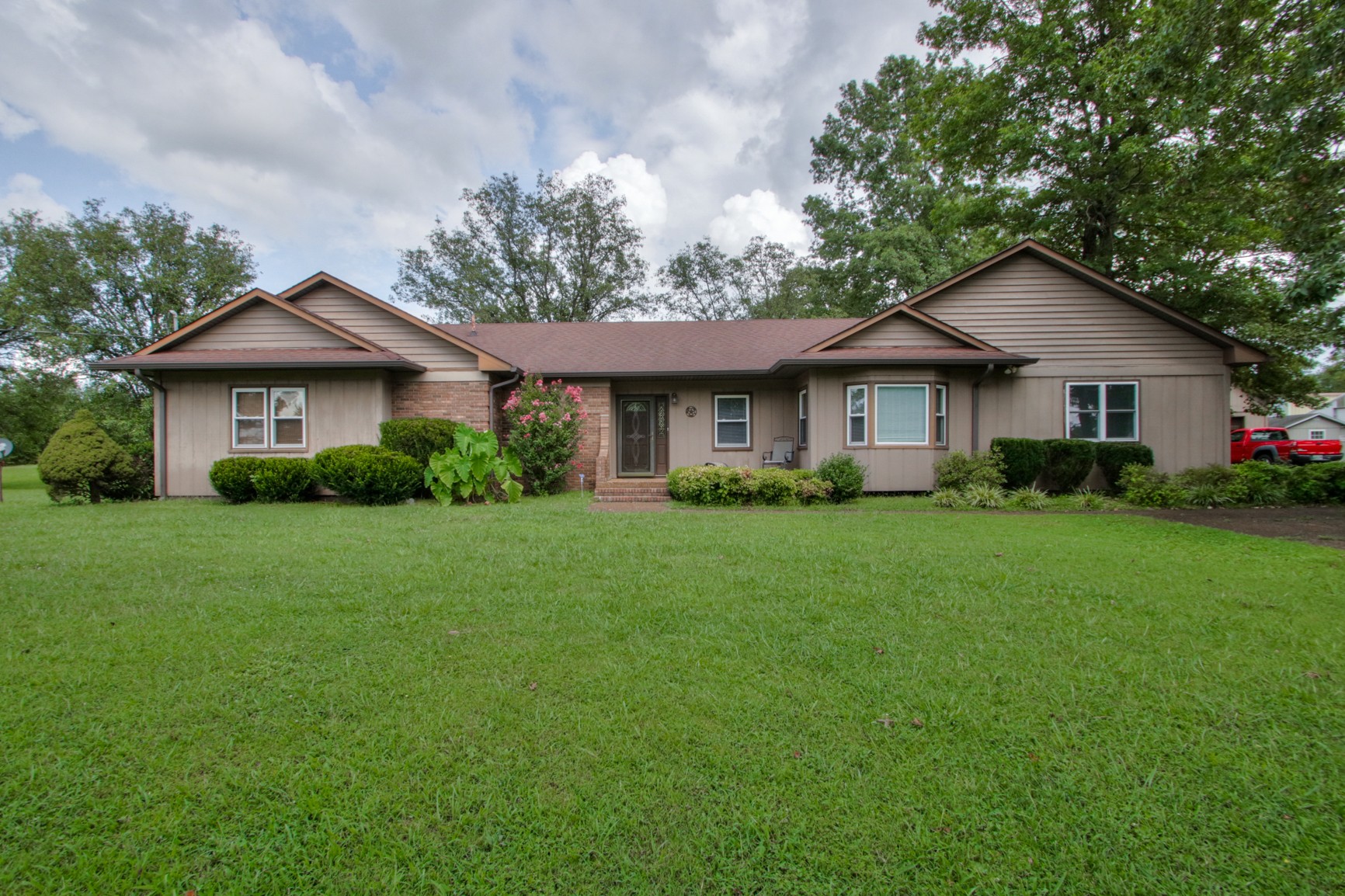 4737 McCrary Road Lebanon, TN 37090 - Photo 21 of 24 a front view of a house with a yard and trees