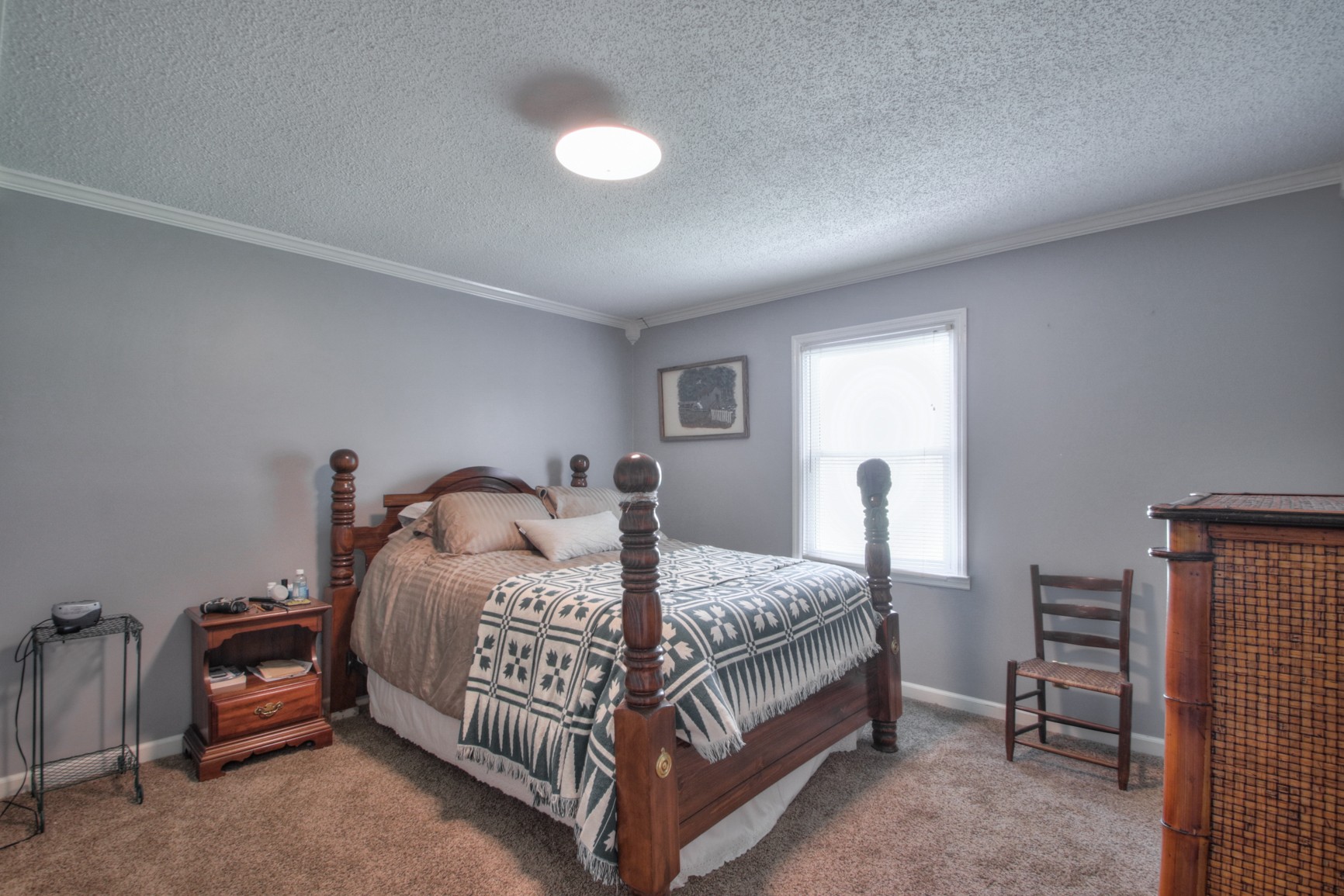 4737 McCrary Road Lebanon, TN 37090 - Photo 10 of 24 a bedroom with a bed and a table in it