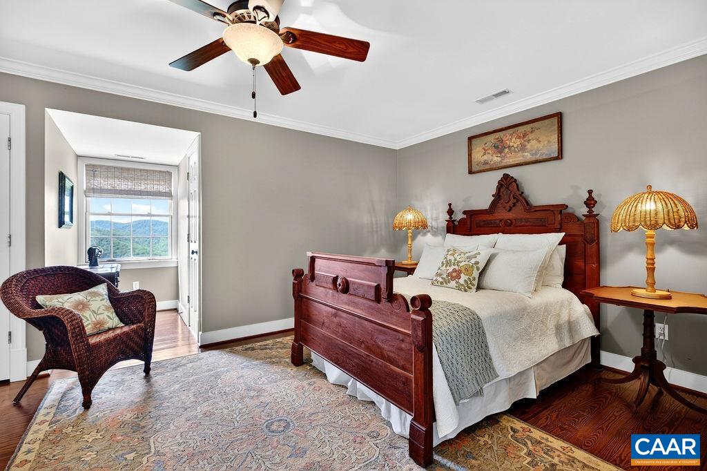 1059 Bryant Mountain Road Roseland, VA 22967 - Photo 34 of 58 a bed room with a bed and chair