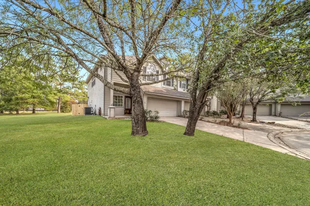 a view of a house with a back yard