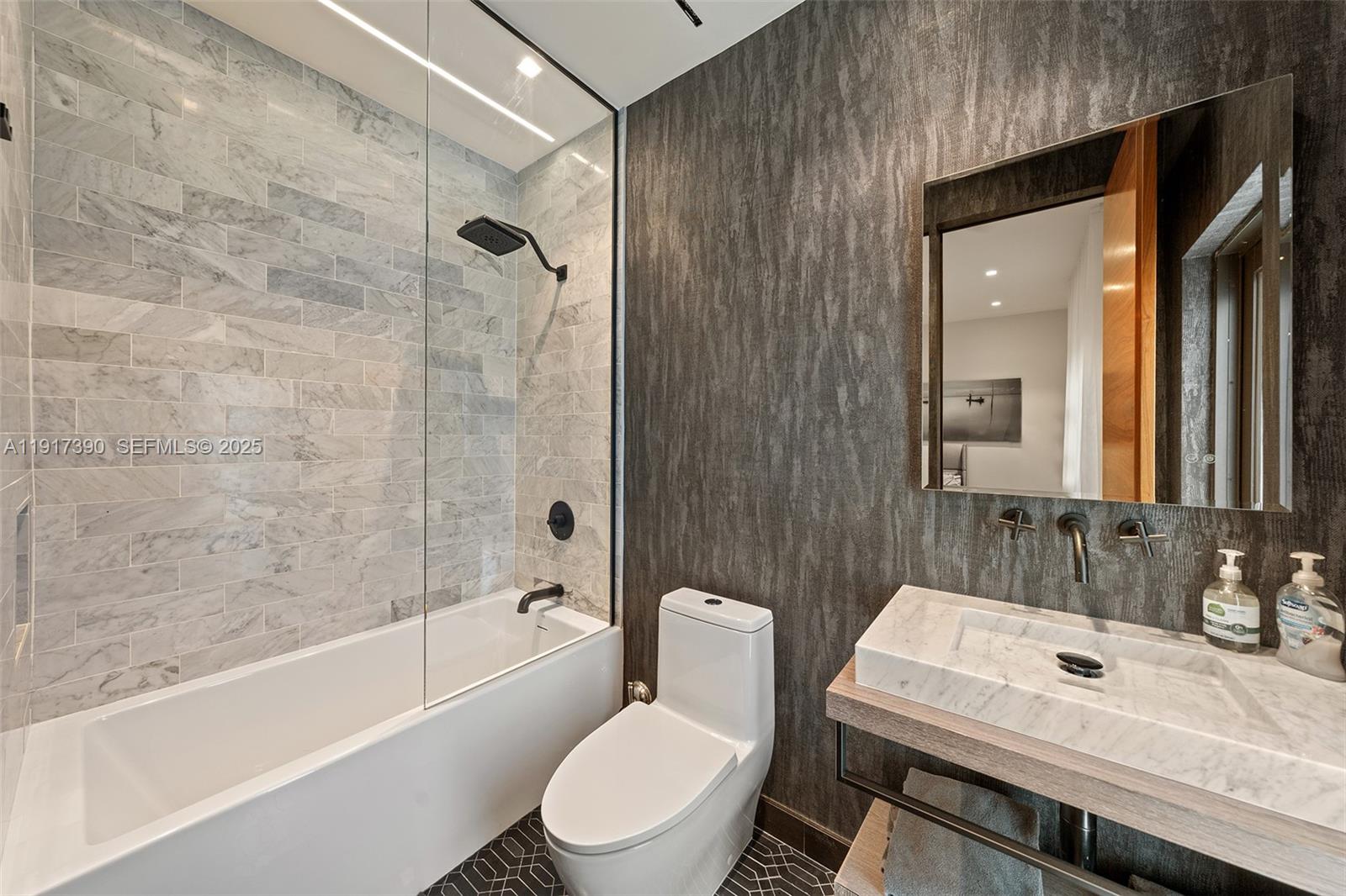 900 Washington Street Hollywood, FL 33019 - Photo 22 of 61 a bathroom with a sink toilet vanity and shower