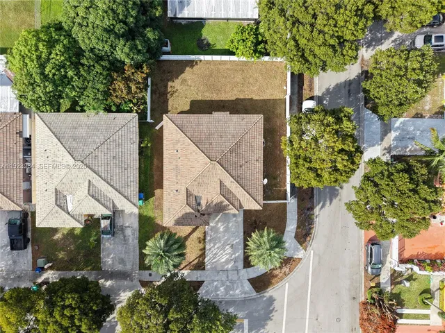 an aerial view of residential building and lake