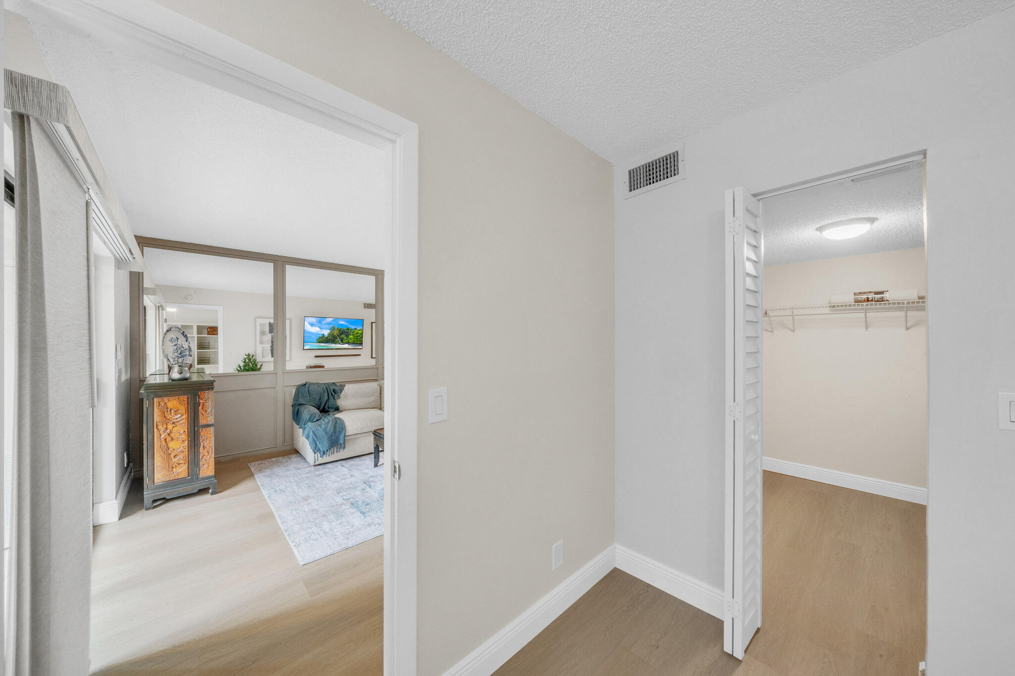 22136 Palms Way, Unit 103 Boca Raton, FL 33433 - Photo 25 of 42 a bedroom with a bed and a view of bathroom