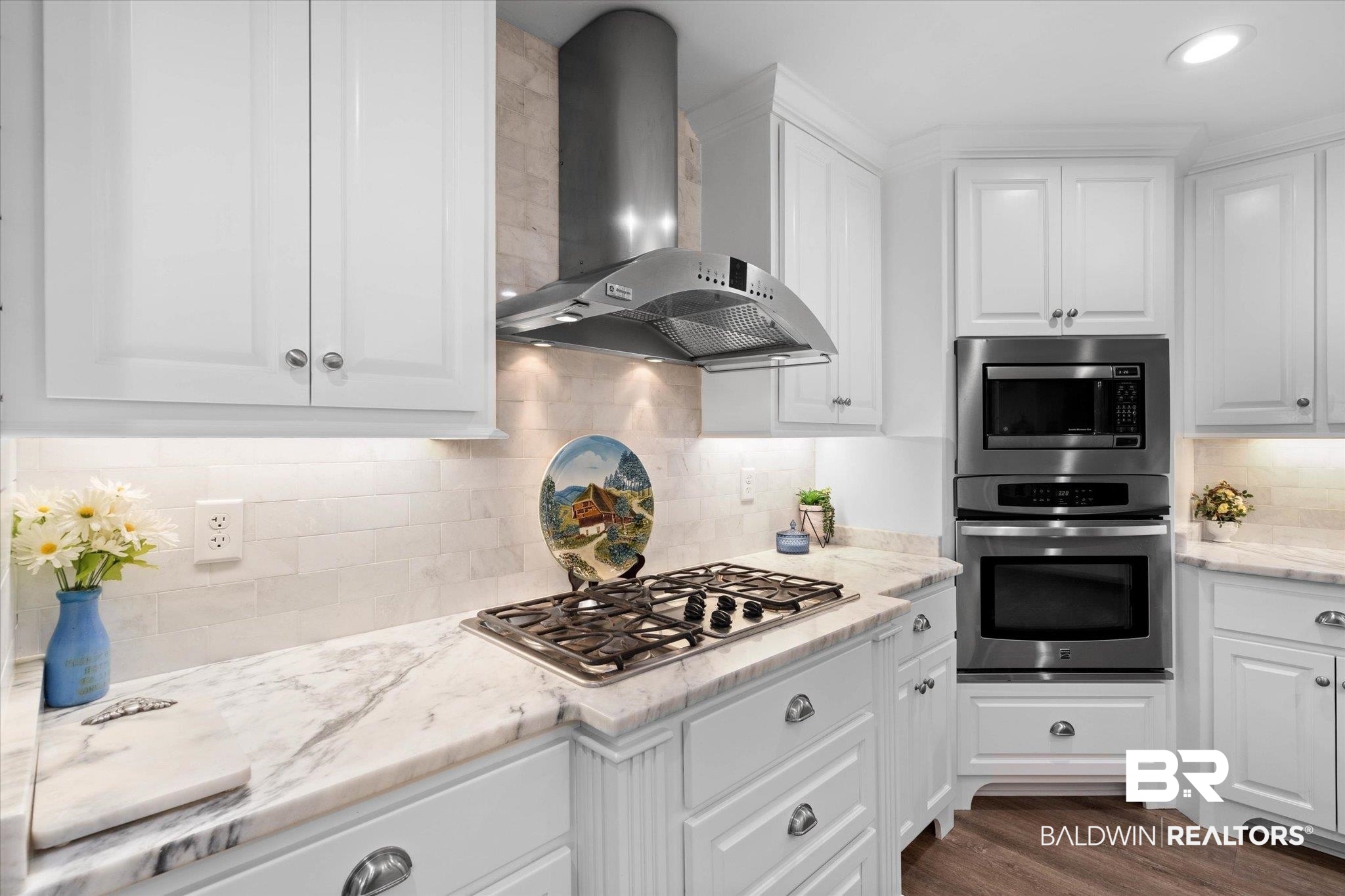 3715 Latigo Road Mobile, AL 36695 - Photo 9 of 39 Kitchen featuring appliances with stainless steel finishes, wall chimney exhaust hood, white cabinets, backsplash, and recessed lighting