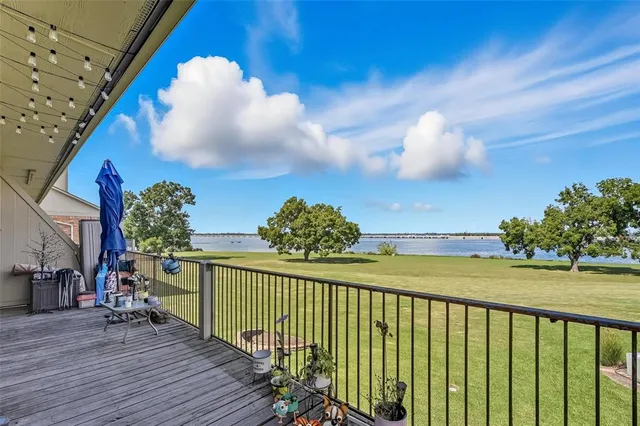 a view of a balcony with wooden floor