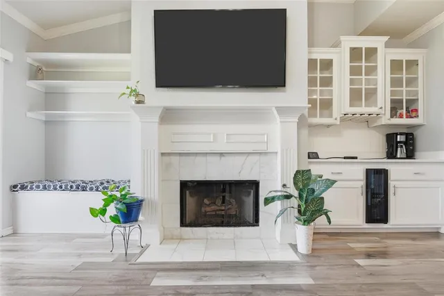 a kitchen with a refrigerator a stove top oven a sink and cabinets