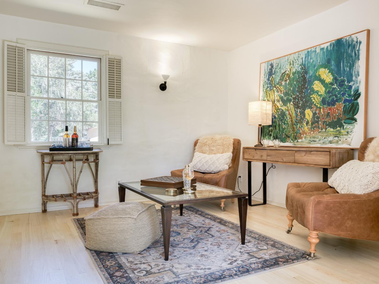 150 Littlefield Road Monterey, CA 93940 - Photo 19 of 51 a living room with furniture and a painting on the wall
