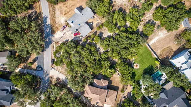 an aerial view of a house with a yard and garden