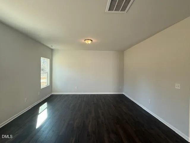 a kitchen with stainless steel appliances granite countertop a sink stove and wooden floor