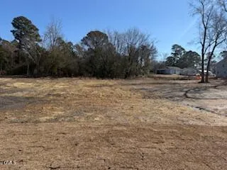 a view of a street with house on the side of the road