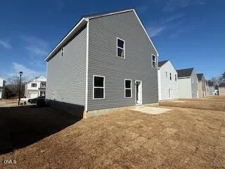 a view of empty field with trees