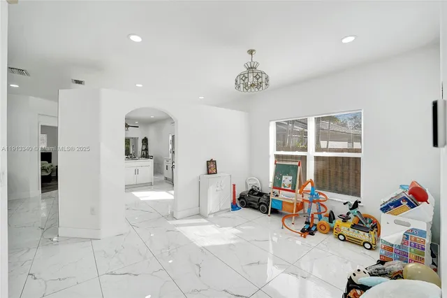 a kitchen with a refrigerator stove and microwave