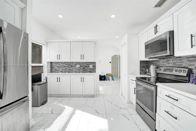 a view of a dining room with furniture