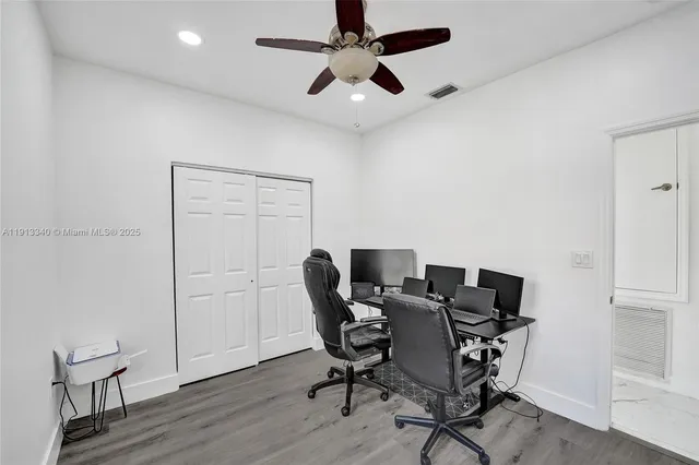 a bathroom with a sink toilet double vanity and shower
