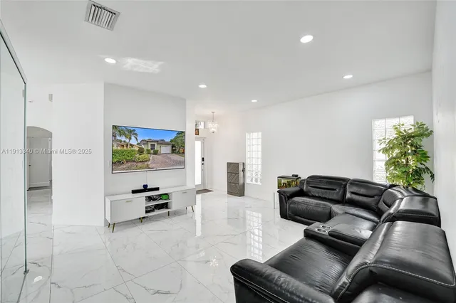 a living room with furniture and a couch