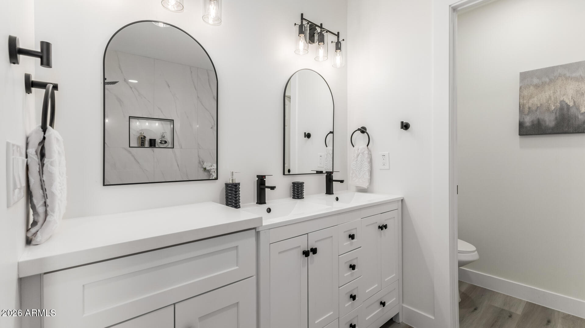 5236 South 19th Avenue Phoenix, AZ 85041 - Photo 18 of 47 a bathroom with a double vanity sink and a mirror