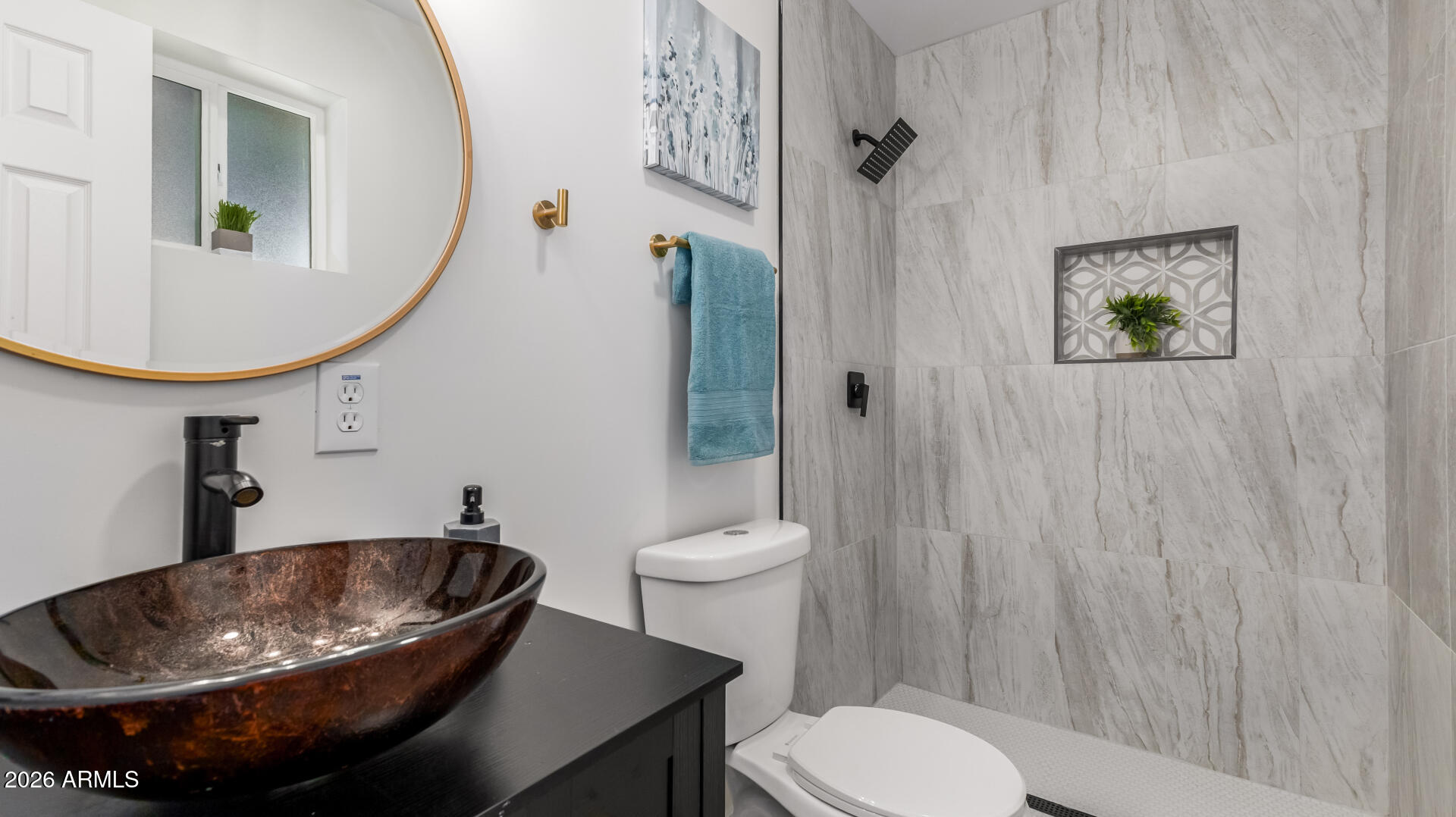 5236 South 19th Avenue Phoenix, AZ 85041 - Photo 27 of 47 a bathroom with a sink toilet and a mirror