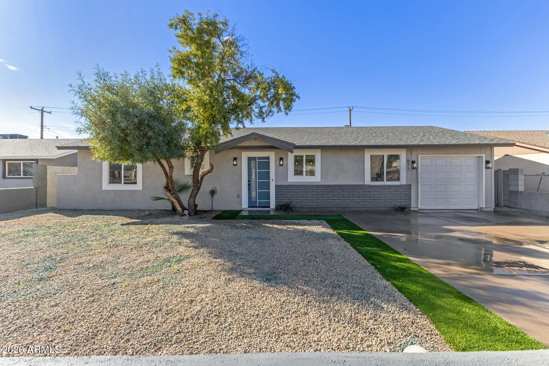5236 South 19th Avenue Phoenix, AZ 85041 - Photo 44 of 47 a front view of a house with a garden
