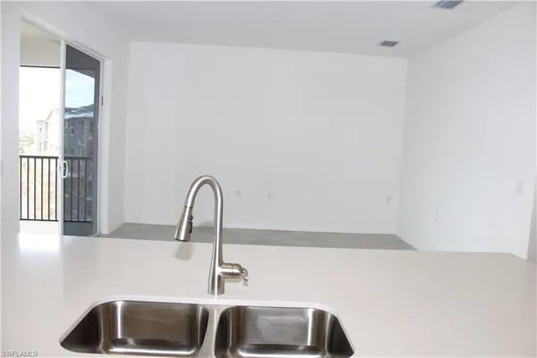 a bathroom with a sink and a window