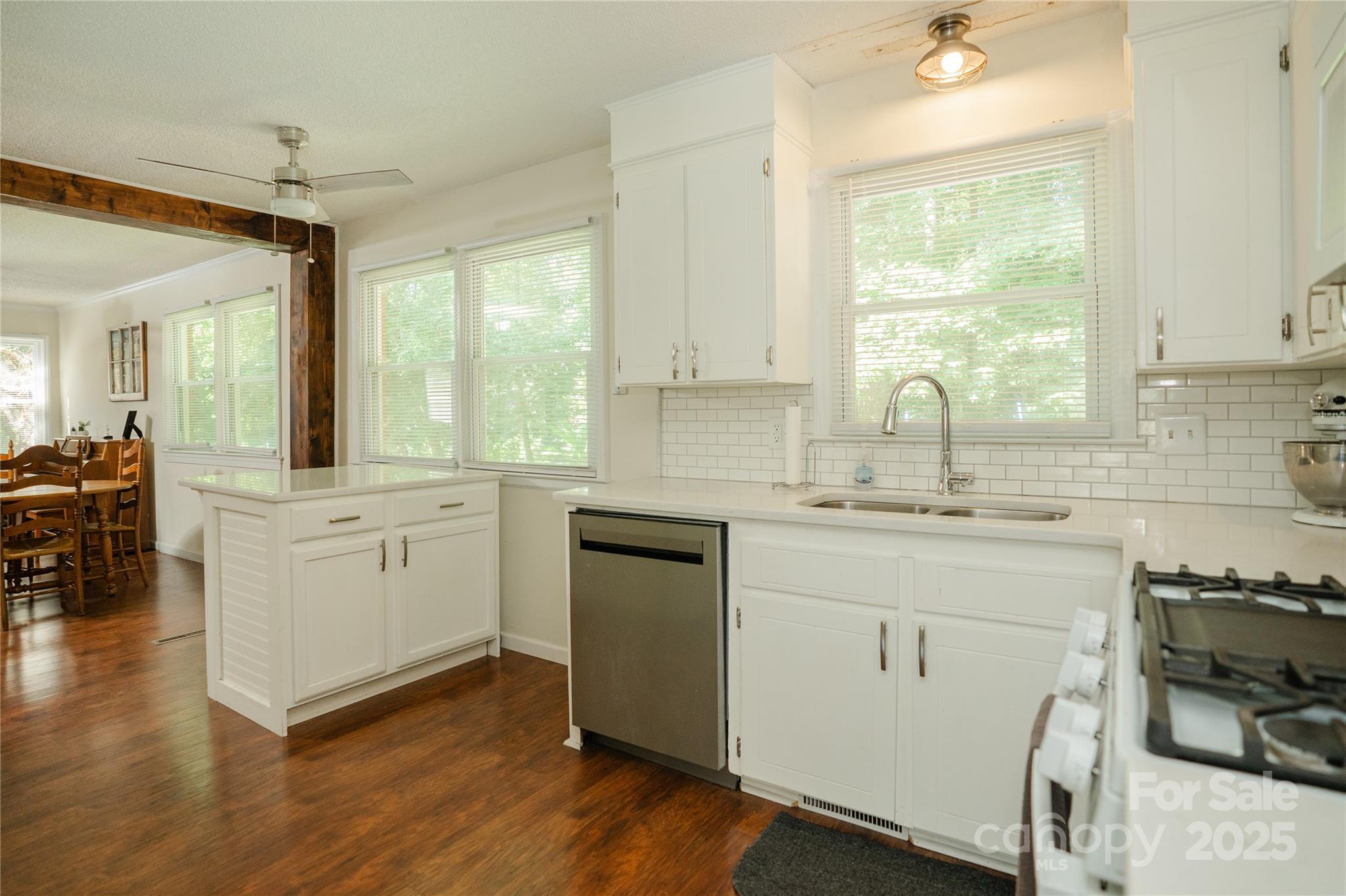 427 Willow Road Salisbury, NC 28147 - Photo 11 of 32 a kitchen with sink cabinets and wooden floor