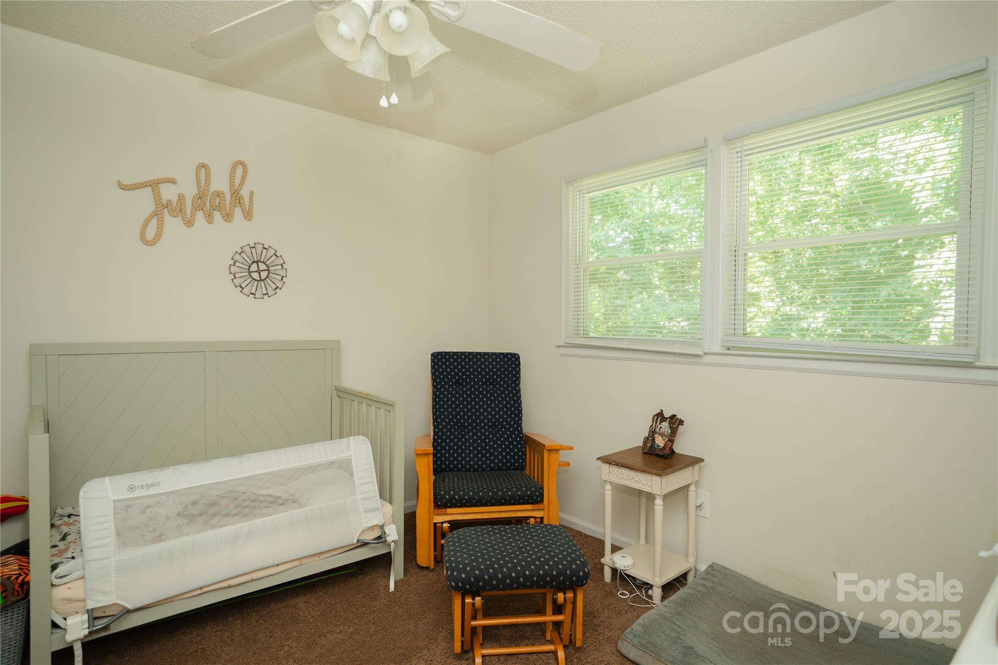 427 Willow Road Salisbury, NC 28147 - Photo 21 of 32 a bedroom with a window and a chair