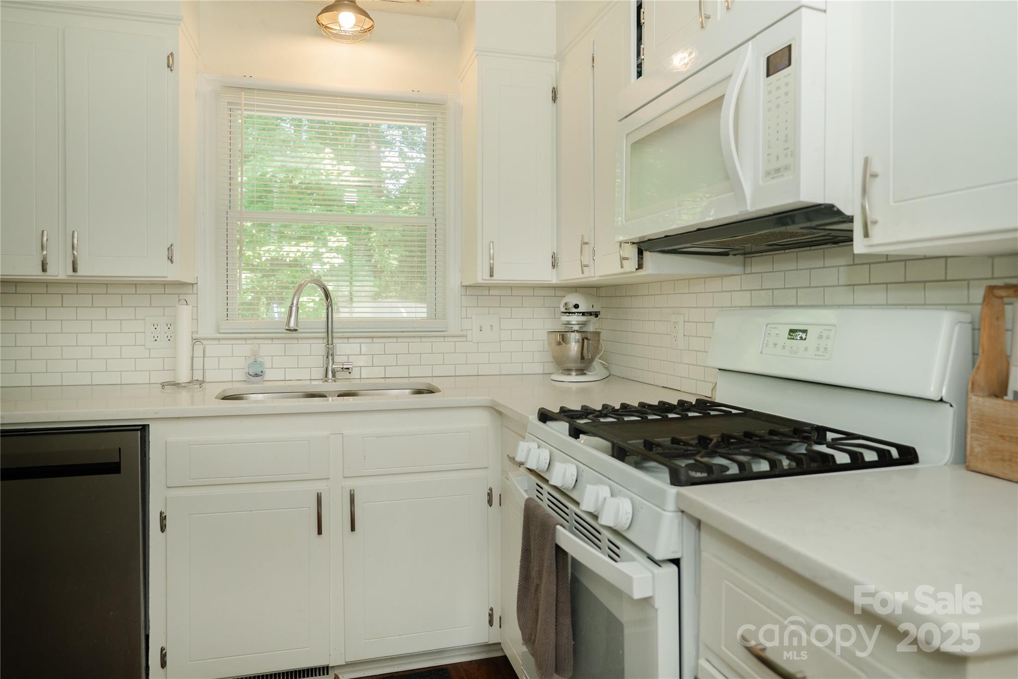 427 Willow Road Salisbury, NC 28147 - Photo 10 of 32 a kitchen with cabinets appliances a sink and a window