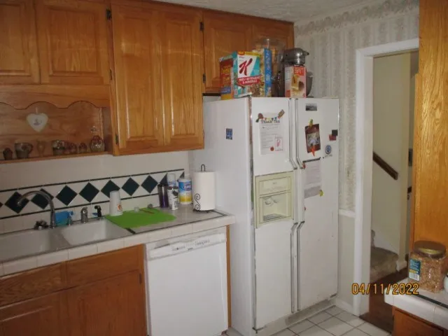 a kitchen with a stove and a cabinet